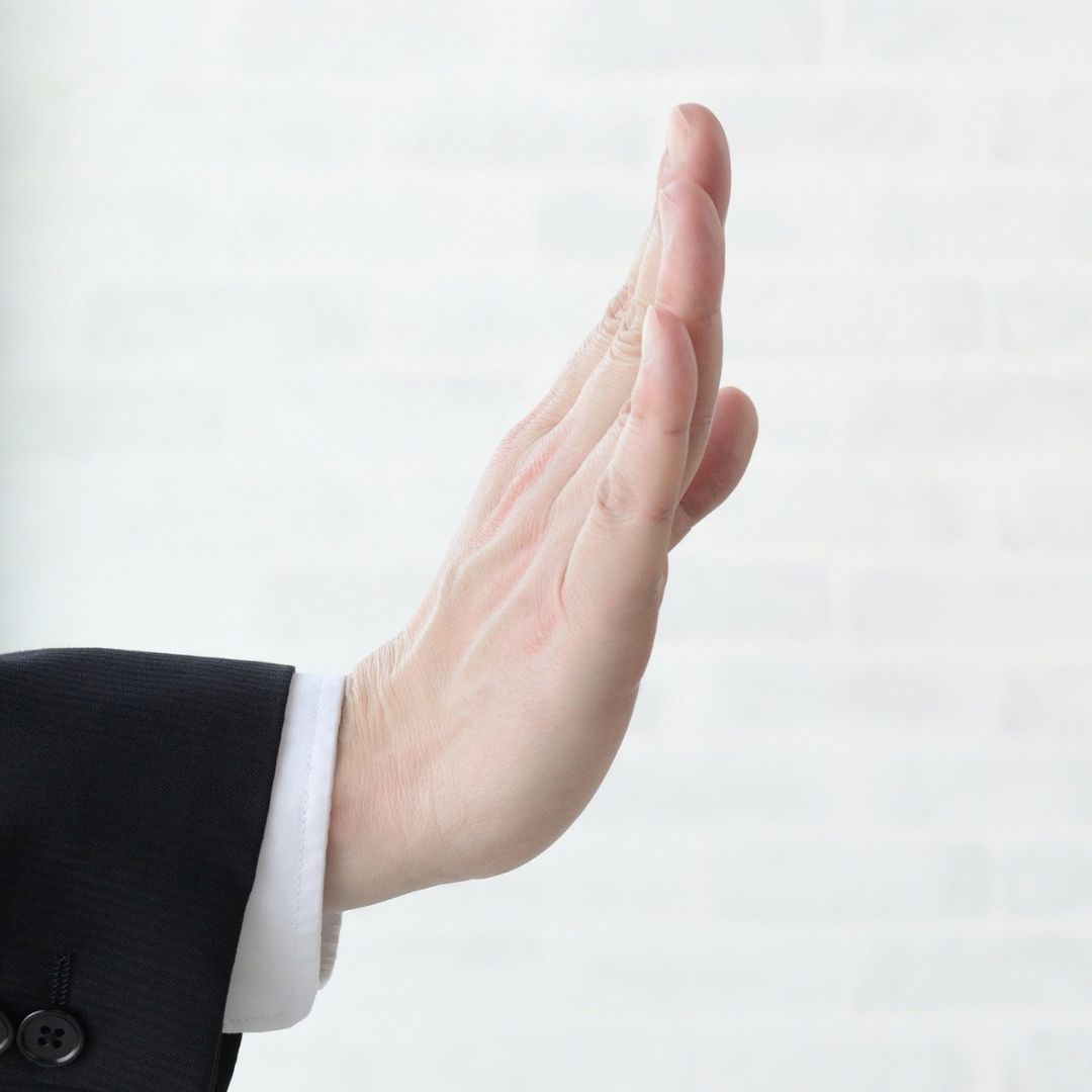 A hand up, indicating a refusal