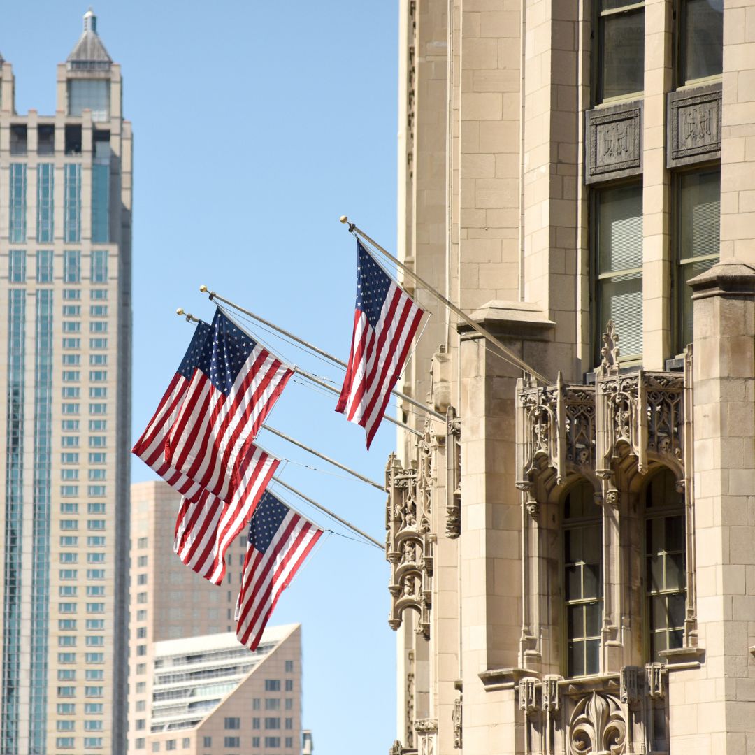 US flags coming from the side of a US building