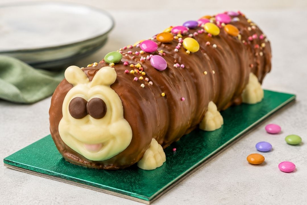 A generic chocolate caterpillar cake with sprinkles