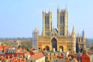 A shot of Lincoln Cathedral, showing the rooftops of nearby buildings.