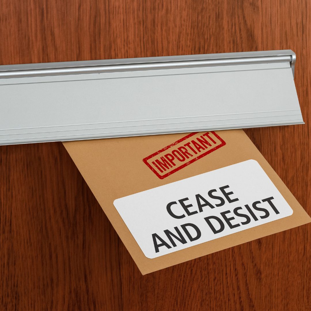 cease and desist letter pushed through a letter box