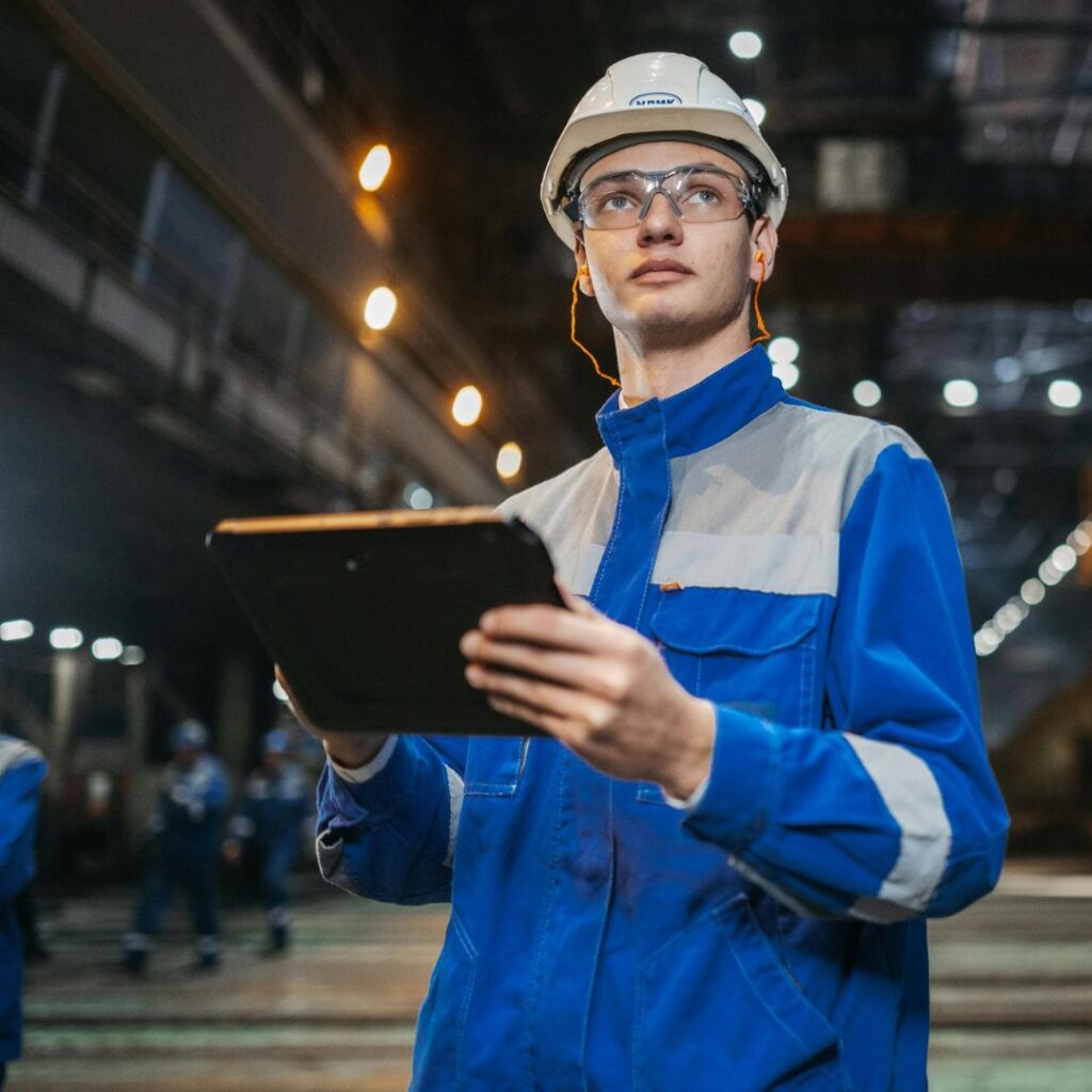An engineer on site, wearing protective clothing