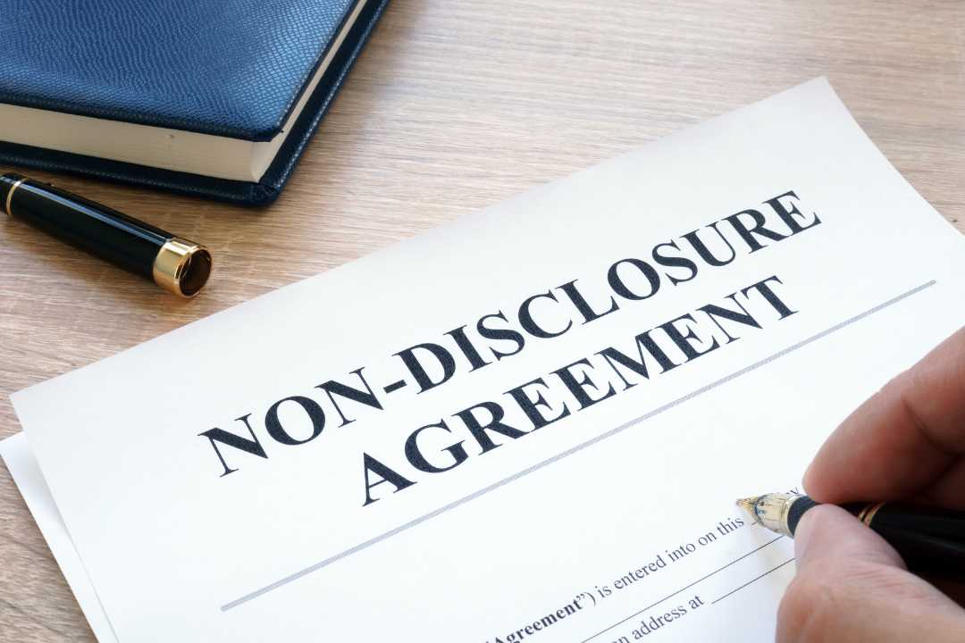 Somebody signing a non disclosure agreement