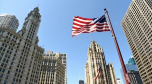 A US flag waving from a building